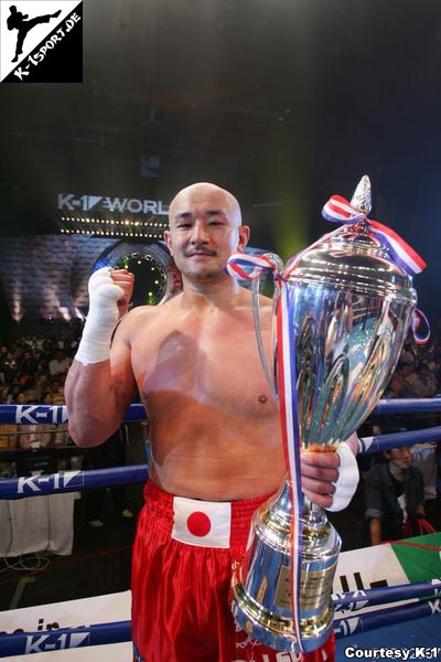 Yusuke Fujimoto with trophy